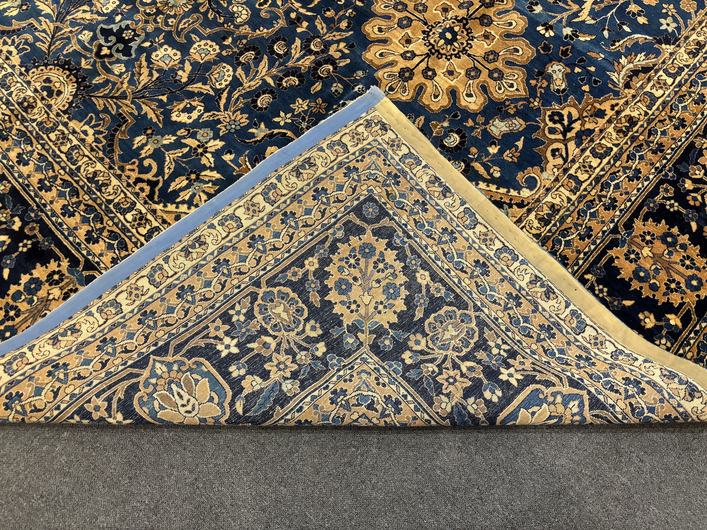 An early 20th century Kirman blue ground carpet, 425 x 325cm